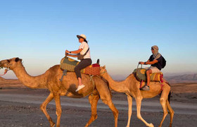 Agafay desert camel ride with dinner and live music.